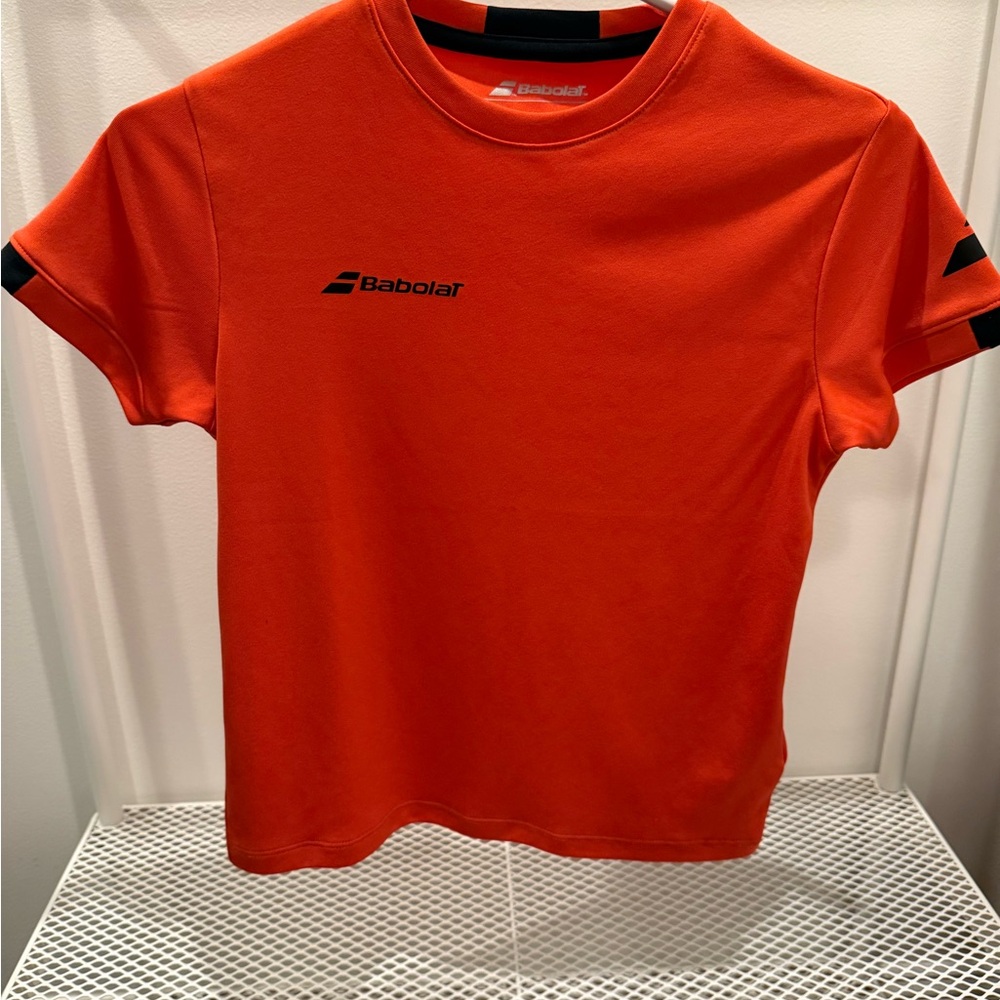 Babolat Kids Vibrant Orange Short Sleeve Exercise Tee, moisture wicking.